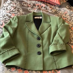 Cute green jacket with black stitching